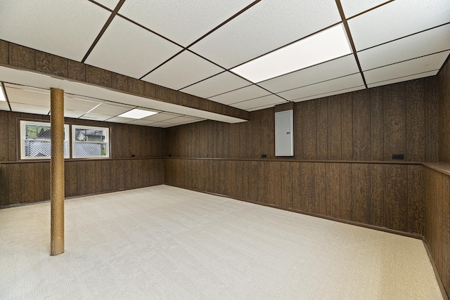 18624 W Pamela Pl, Gurnee, IL 60031 - below grade area featuring wood walls, a drop ceiling, electric panel, and light carpet