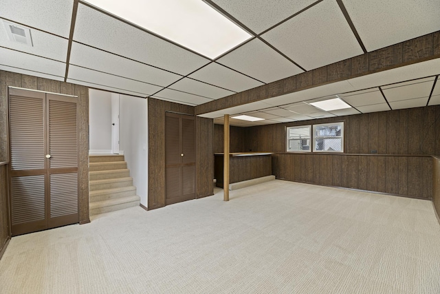 18624 W Pamela Pl, Gurnee, IL 60031 - basement with visible vents, a drop ceiling, wood walls, and carpet flooring