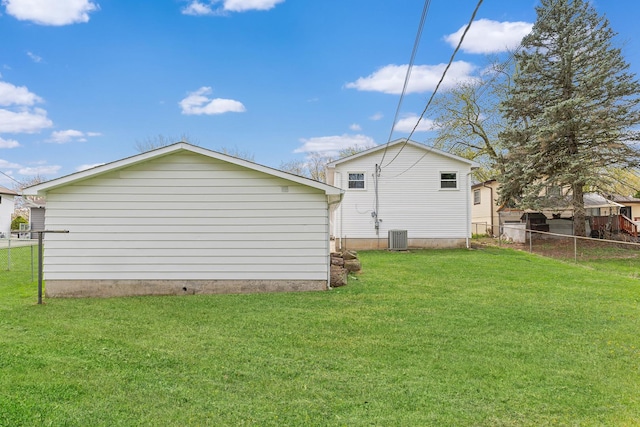 18624 W Pamela Pl, Gurnee, IL 60031 - rear view of house featuring a yard, central AC, and fence