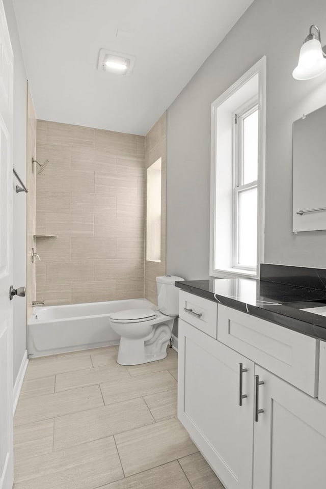full bathroom with toilet, bathing tub / shower combination, tile patterned flooring, and vanity