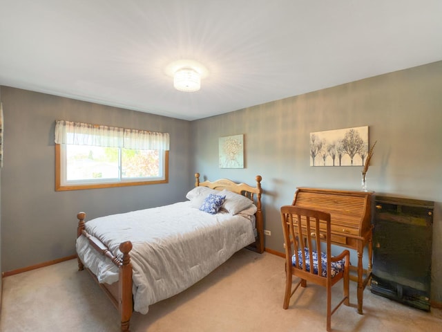 bedroom featuring carpet flooring and baseboards