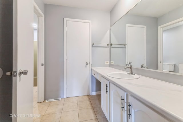 bathroom with vanity and tile patterned floors