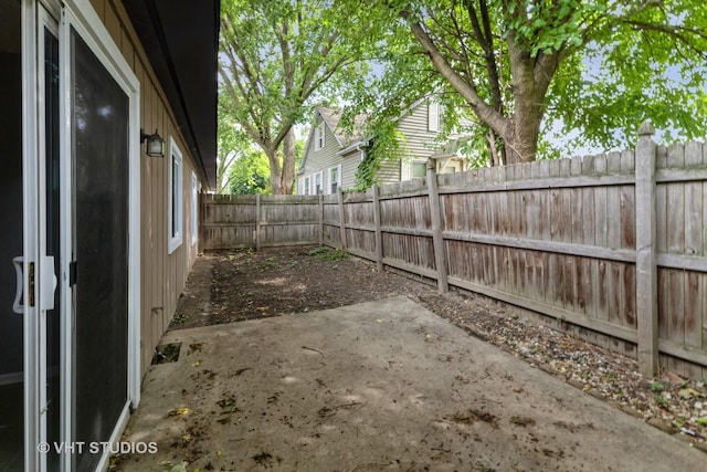 fenced backyard with a patio