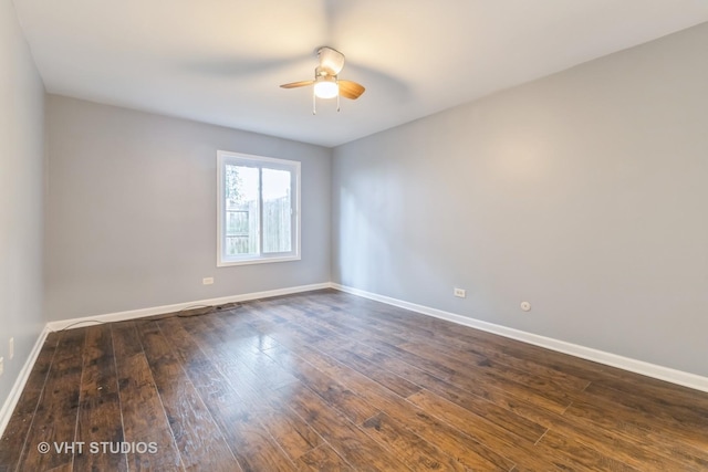 unfurnished room featuring ceiling fan and dark wood-style floors