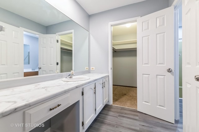 bathroom featuring vanity and wood finished floors