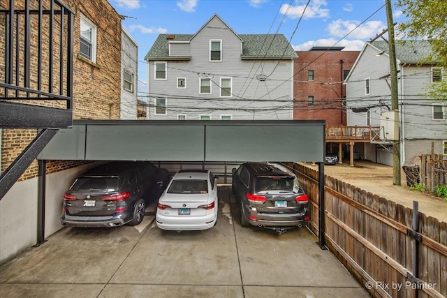 covered parking lot with fence