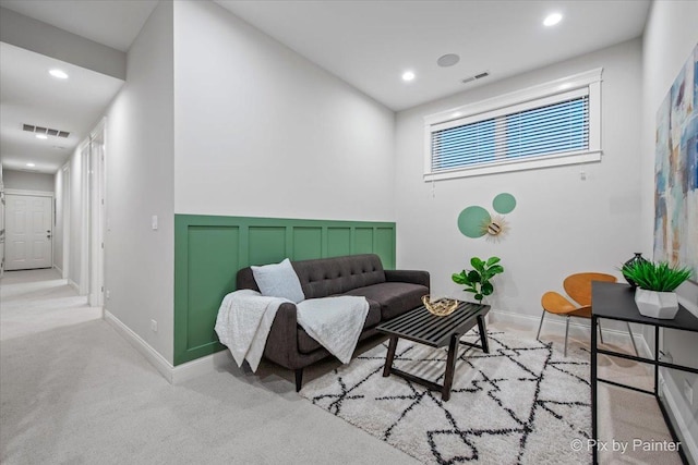 living room featuring recessed lighting, visible vents, and carpet