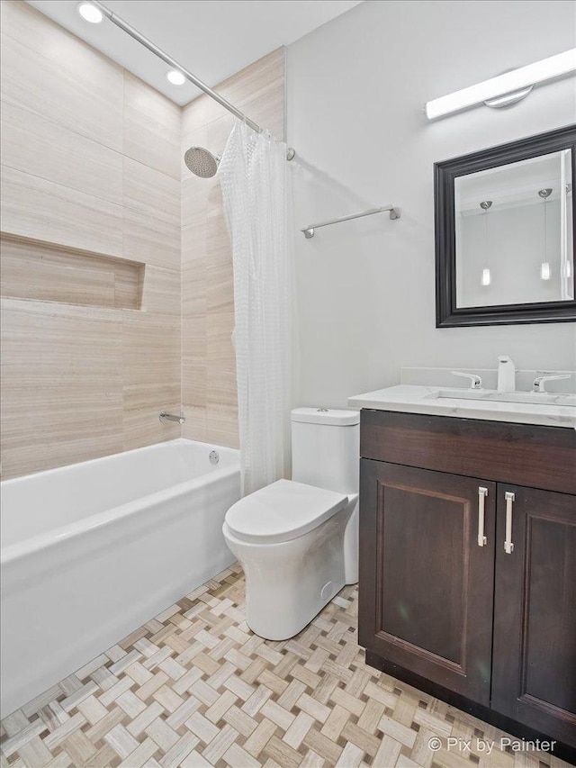 full bathroom featuring toilet, shower / tub combo, and vanity