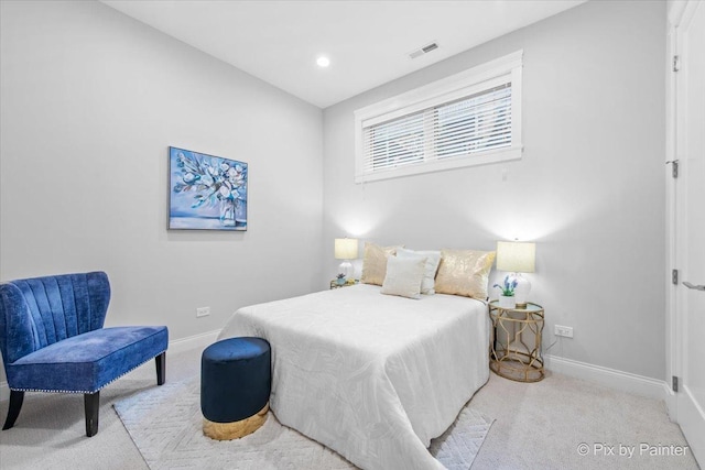 carpeted bedroom with baseboards and visible vents