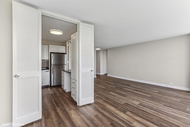 4800 S Chicago Beach Dr Unit 1005N, Chicago, IL 60615 - unfurnished living room featuring baseboards and dark wood-type flooring
