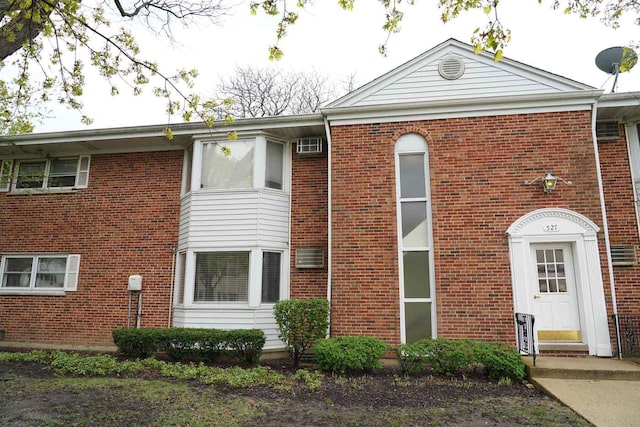 view of home's exterior with brick siding