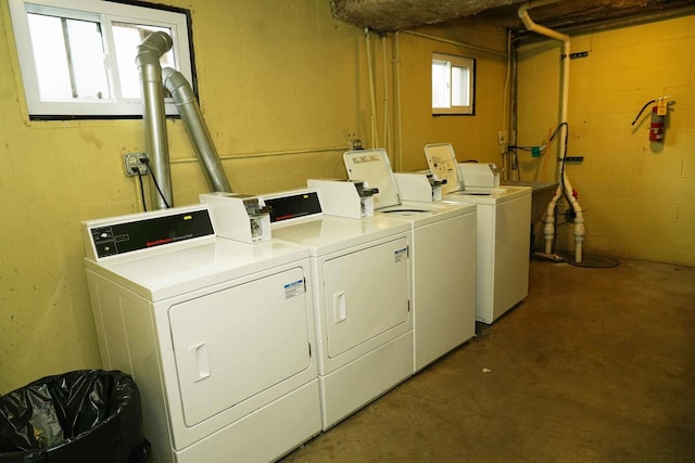 shared laundry area featuring washing machine and dryer