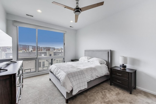 bedroom featuring a ceiling fan, visible vents, light colored carpet, baseboards, and recessed lighting