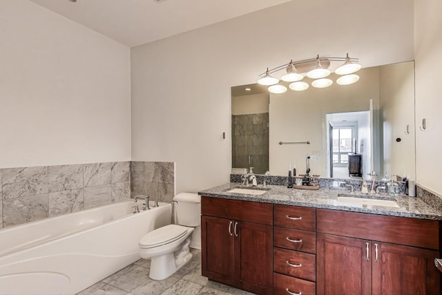 full bath with a garden tub, a sink, double vanity, and toilet
