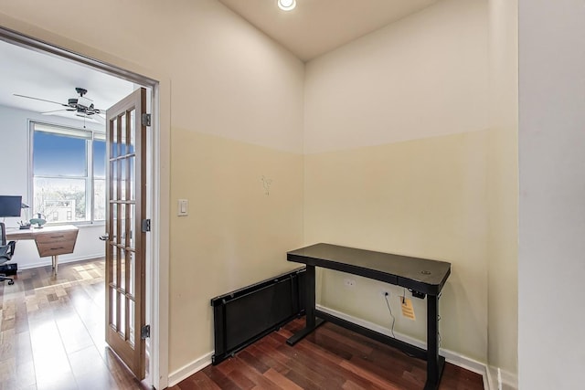 hall with recessed lighting, baseboards, and dark wood-type flooring