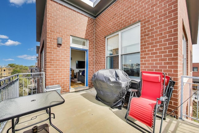 view of patio with a balcony and area for grilling