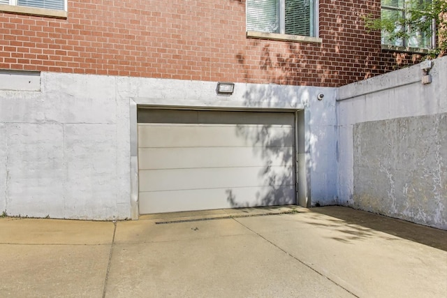 garage with concrete driveway