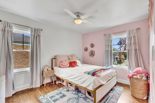 7428 N Odell Ave, Chicago, IL 60631 - bedroom featuring baseboards, ceiling fan, and wood finished floors