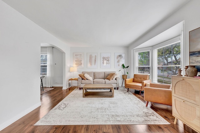 7428 N Odell Ave, Chicago, IL 60631 - living area with dark wood finished floors, baseboards, and arched walkways