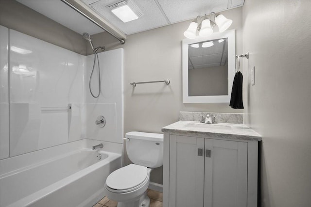bathroom with toilet, baseboards, bathing tub / shower combination, and vanity