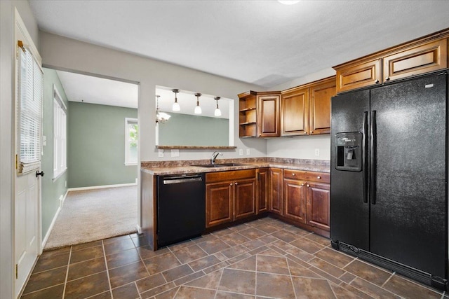 kitchen with open shelves, a sink, brown cabinetry, dark carpet, and black appliances