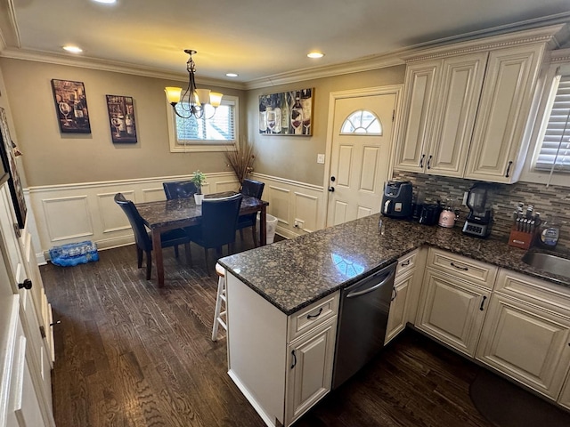 3825 W Pippin St, Chicago, IL 60652 - kitchen with stainless steel dishwasher, wainscoting, a peninsula, an inviting chandelier, and dark wood-type flooring