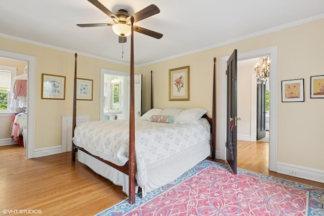 283 Ridge Ave, Winnetka, IL 60093 - bedroom with light wood finished floors, crown molding, baseboards, ceiling fan, and connected bathroom