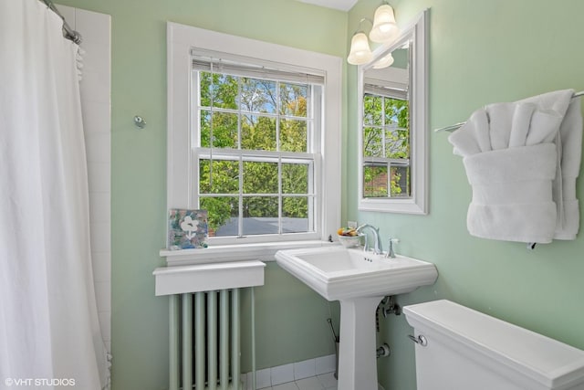 283 Ridge Ave, Winnetka, IL 60093 - full bathroom featuring toilet, radiator heating unit, and curtained shower