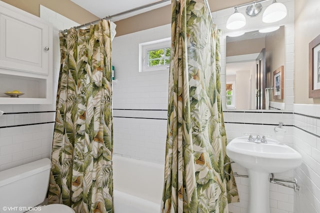 283 Ridge Ave, Winnetka, IL 60093 - bathroom with tile walls, shower / tub combo with curtain, and toilet