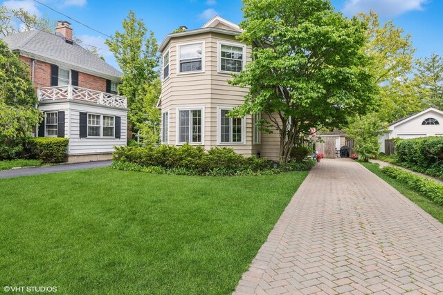 283 Ridge Ave, Winnetka, IL 60093 - view of front facade with a front yard and decorative driveway