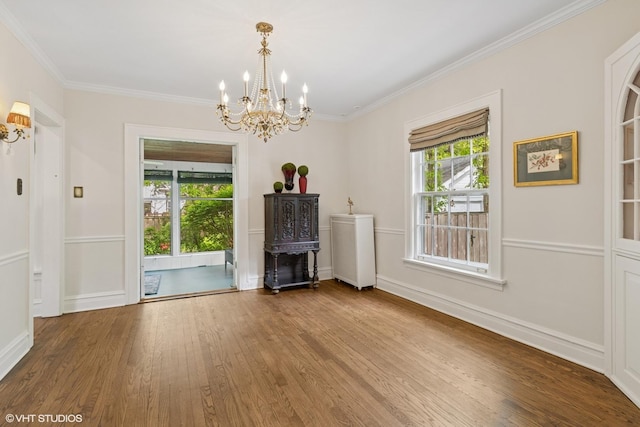 283 Ridge Ave, Winnetka, IL 60093 - living area with a chandelier, wood finished floors, healthy amount of natural light, ornamental molding, and baseboards