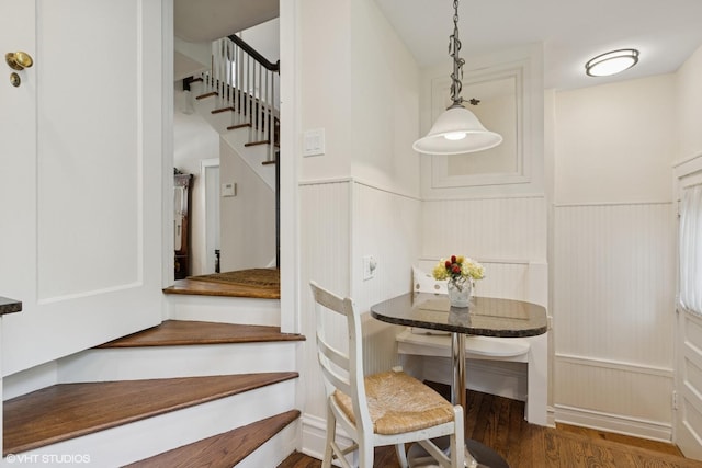 283 Ridge Ave, Winnetka, IL 60093 - staircase featuring a wainscoted wall, wood finished floors, and a decorative wall