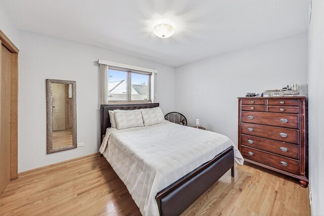 bedroom featuring light wood-style flooring