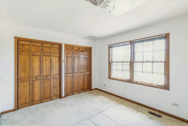 2339 N James Ct, Arlington Heights, IL 60004 - unfurnished bedroom with two closets and baseboards