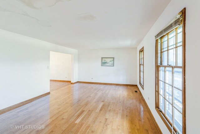2339 N James Ct, Arlington Heights, IL 60004 - unfurnished room featuring light wood finished floors and baseboards