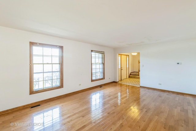 2339 N James Ct, Arlington Heights, IL 60004 - empty room with light wood finished floors and baseboards