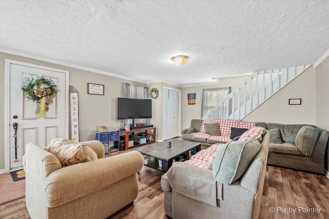 2381 Elm Rd, West Chicago, IL 60185 - living room with crown molding, stairs, wood finished floors, and a textured ceiling