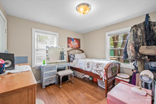 2381 Elm Rd, West Chicago, IL 60185 - bedroom with light wood finished floors and multiple windows