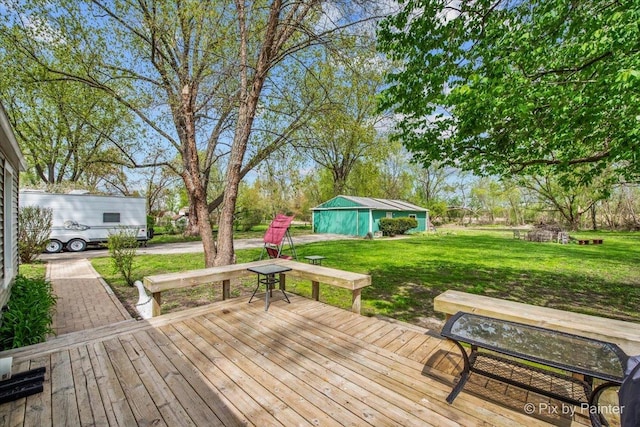 2381 Elm Rd, West Chicago, IL 60185 - wooden terrace featuring a lawn and an outbuilding