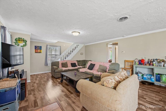 2381 Elm Rd, West Chicago, IL 60185 - living area featuring wood finished floors, stairway, ornamental molding, a textured ceiling, and baseboards