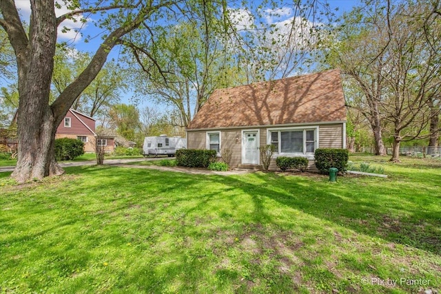2381 Elm Rd, West Chicago, IL 60185 - cape cod-style house featuring a front yard and entry steps