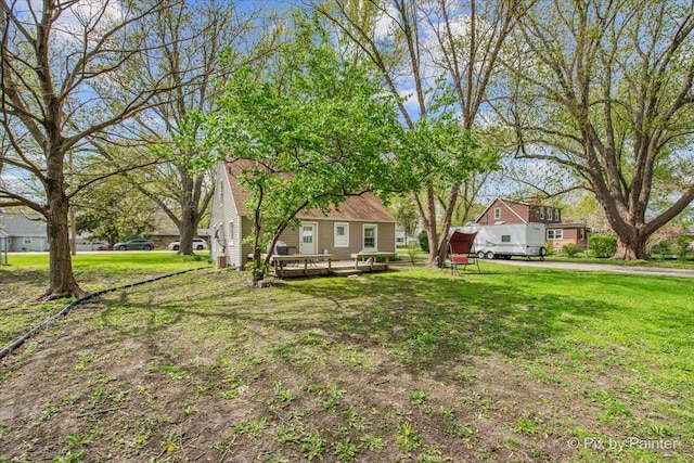 2381 Elm Rd, West Chicago, IL 60185 - view of grassy yard featuring a deck