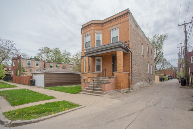 view of front of home featuring brick siding and a garage