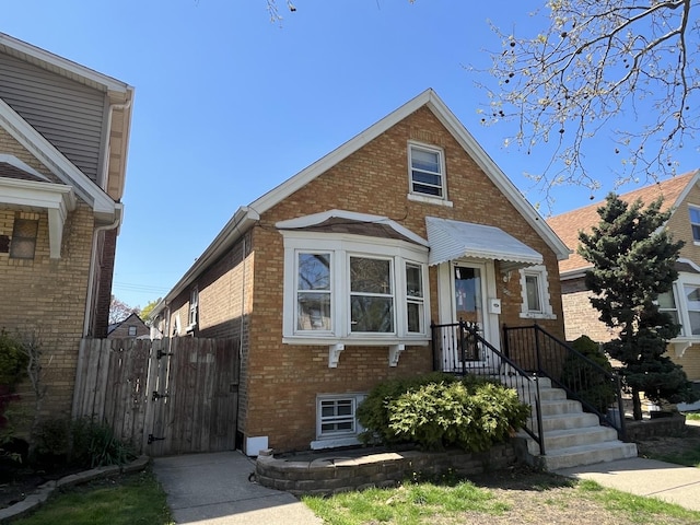 5834 S Keeler Ave, Chicago, IL 60629 - view of front facade featuring brick siding and a gate