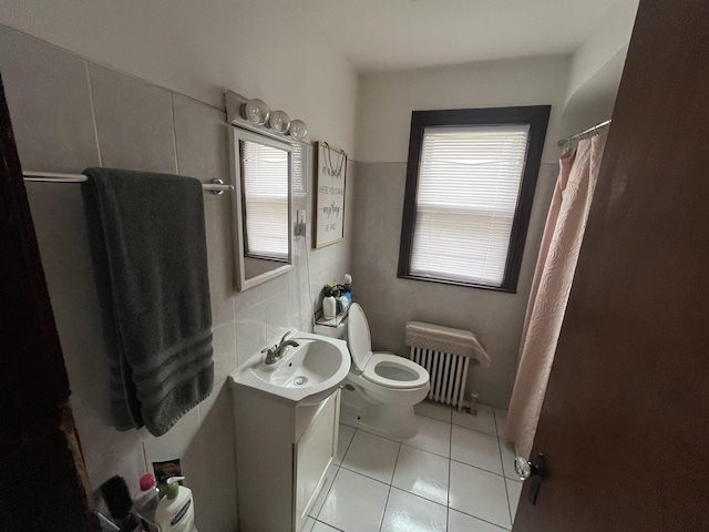 5834 S Keeler Ave, Chicago, IL 60629 - full bath featuring vanity, tile patterned flooring, plenty of natural light, and radiator