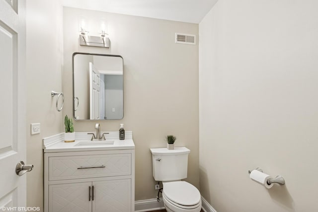 1499 Shagbark Dr, Bolingbrook, IL 60490 - bathroom featuring vanity, toilet, baseboards, and visible vents