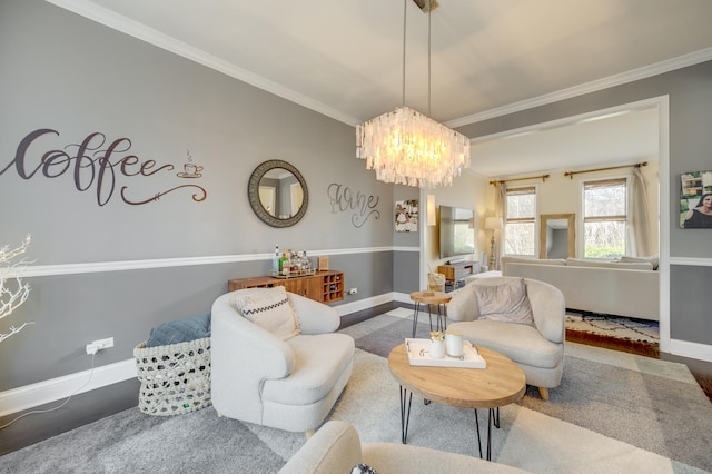 living room featuring crown molding, baseboards, and a notable chandelier