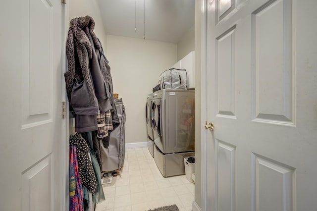 laundry room featuring laundry area and washing machine and clothes dryer