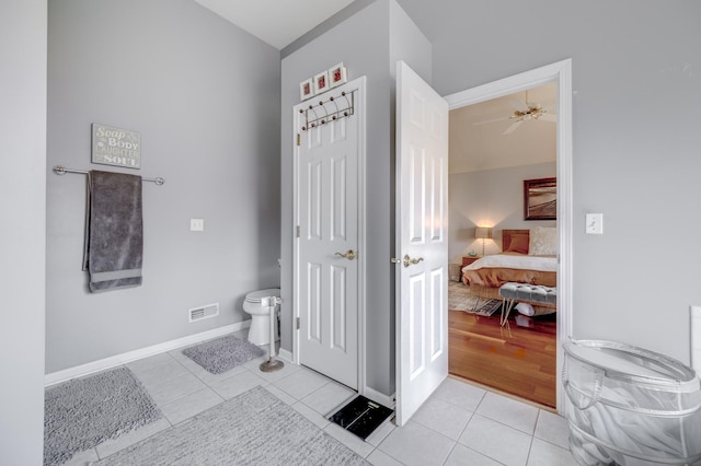 bathroom with ceiling fan, tile patterned flooring, ensuite bath, toilet, and visible vents