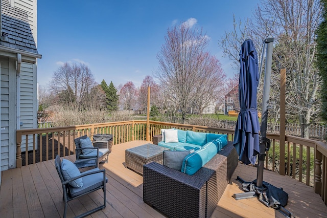wooden terrace featuring outdoor lounge area